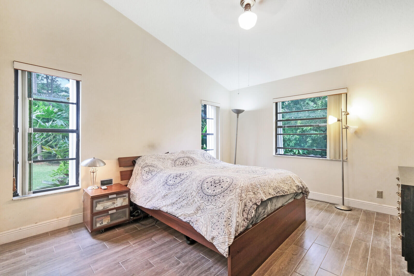 17520 Bridle Court Jupiter, FL 33478 - Photo 25 of 35 a bedroom with a bed a window and walk in closet