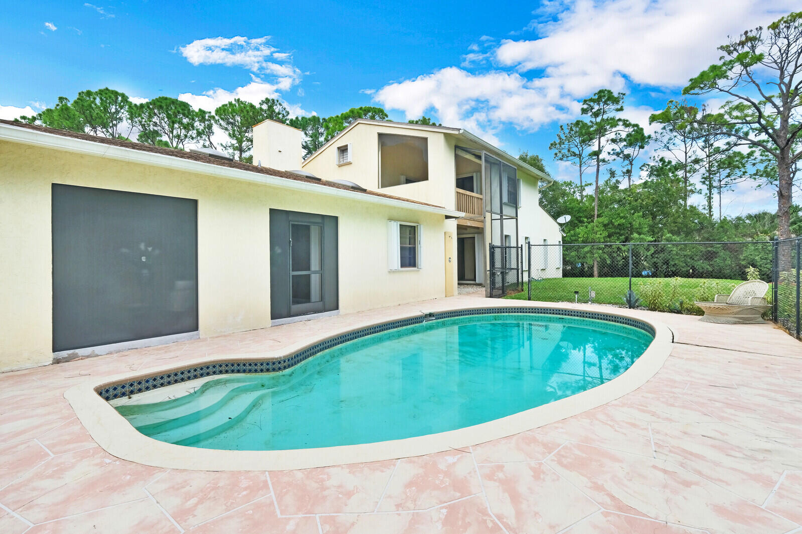 17520 Bridle Court Jupiter, FL 33478 - Photo 34 of 35 a view of a swimming pool with a yard