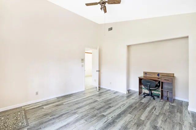 a view of room with wooden floor