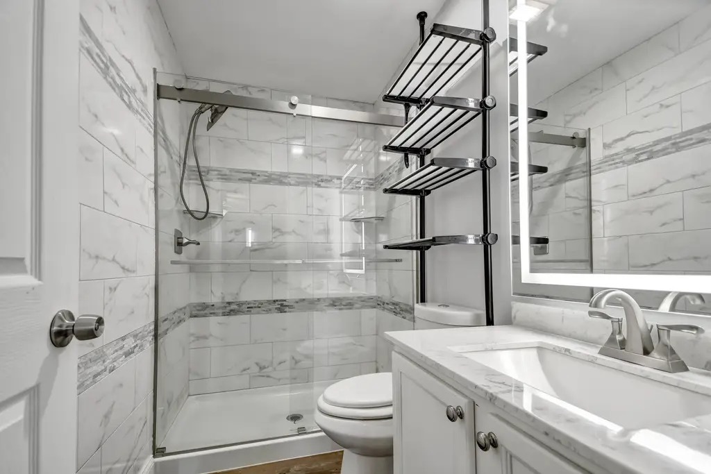 142 Azalea Circle Romeoville, IL 60446 - Photo 11 of 15 a bathroom with a sink toilet and shower