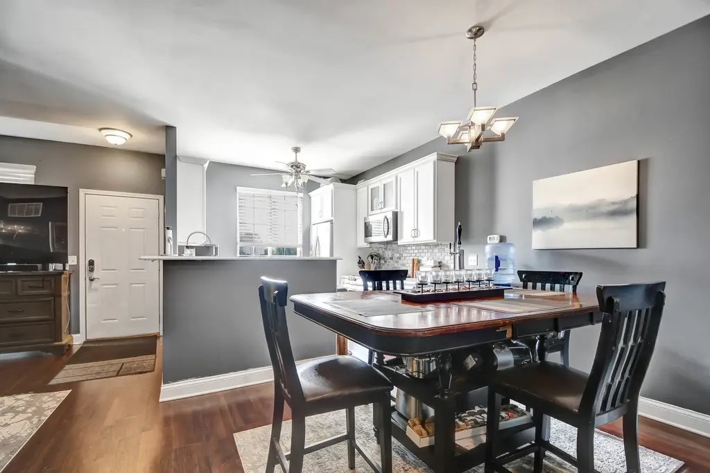 142 Azalea Circle Romeoville, IL 60446 - Photo 5 of 15 a view of a dining room and a kitchen with a dining table chairs
