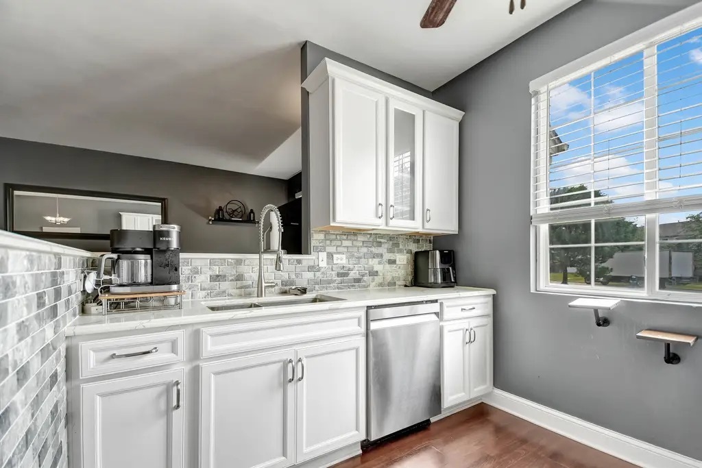 142 Azalea Circle Romeoville, IL 60446 - Photo 7 of 15 a kitchen with a sink cabinets and window