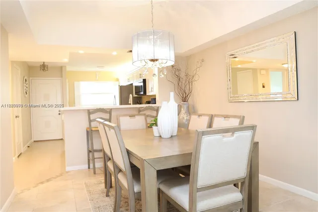 a spacious bedroom with a bed and a potted plant