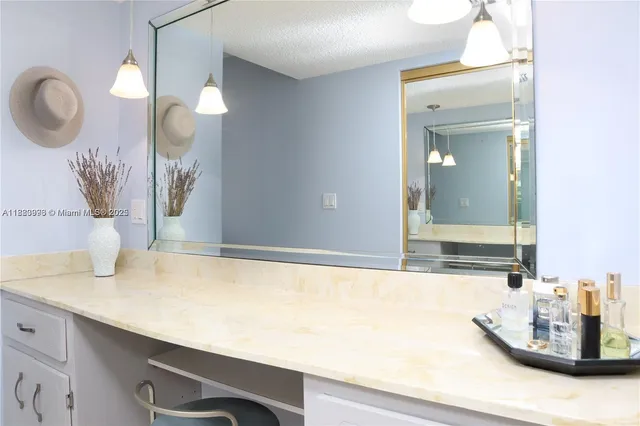 a view of a bathroom sink and mirror