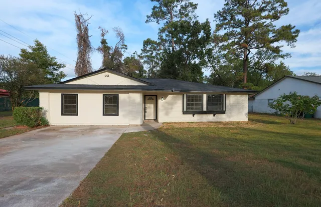 front view of a house with a garden