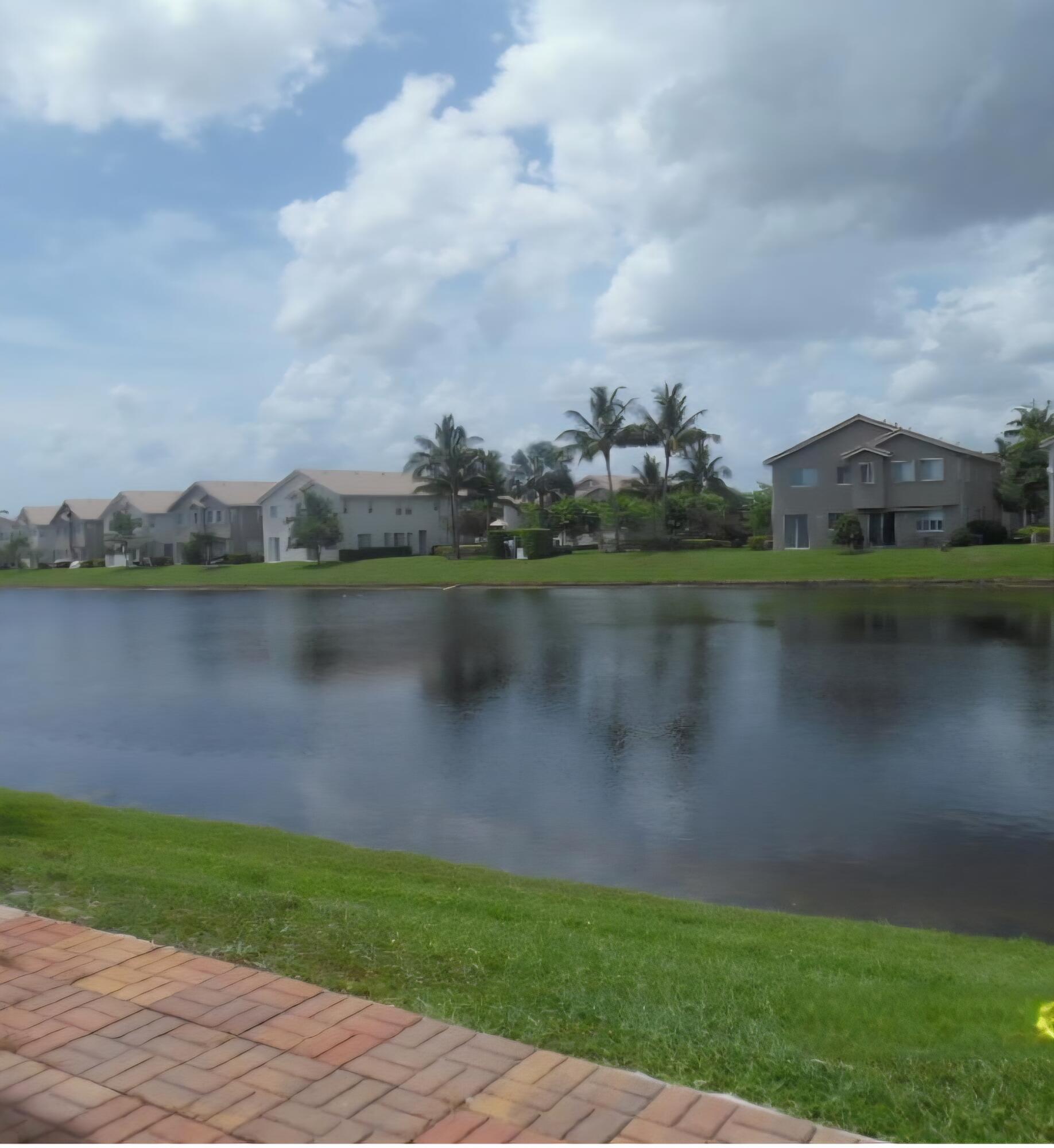 3182 Laurel Ridge Circle Riviera Beach, FL 33404 - Photo 2 of 29 a view of a lake
