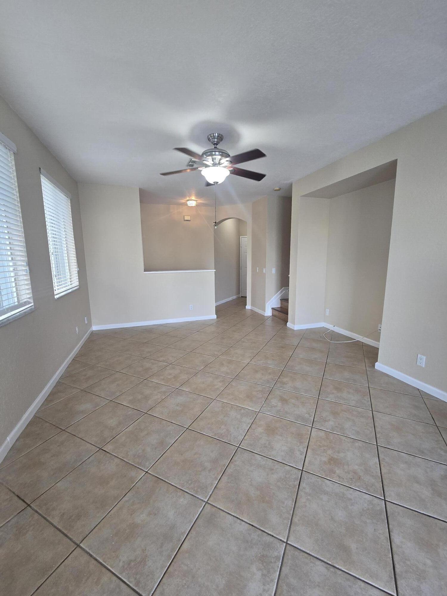 3182 Laurel Ridge Circle Riviera Beach, FL 33404 - Photo 24 of 29 a view of a livingroom with a ceiling fan and window