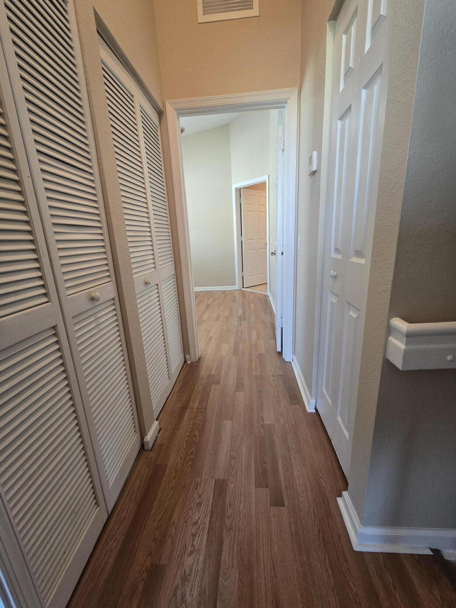 3182 Laurel Ridge Circle Riviera Beach, FL 33404 - Photo 27 of 29 a view of a hallway and wooden floor