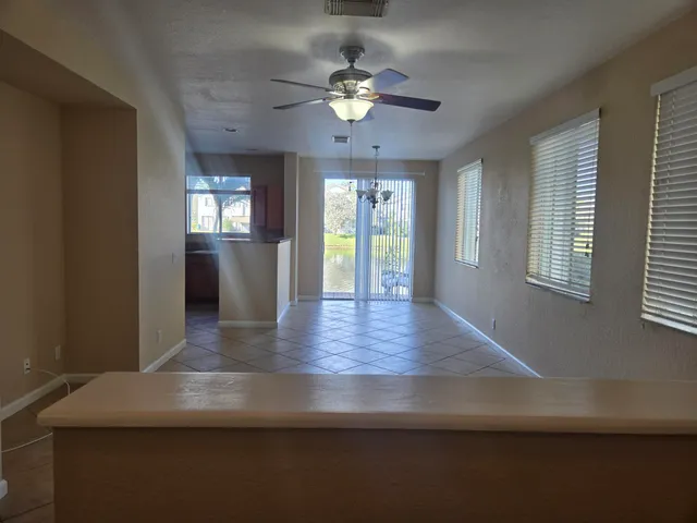 a kitchen with stainless steel appliances granite countertop a refrigerator and a stove