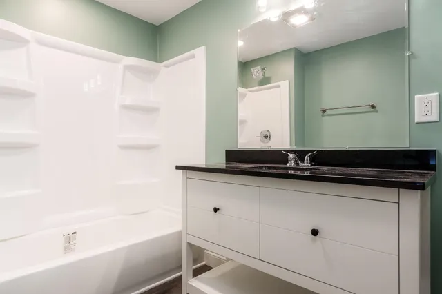 a bathroom with a sink and a bathtub
