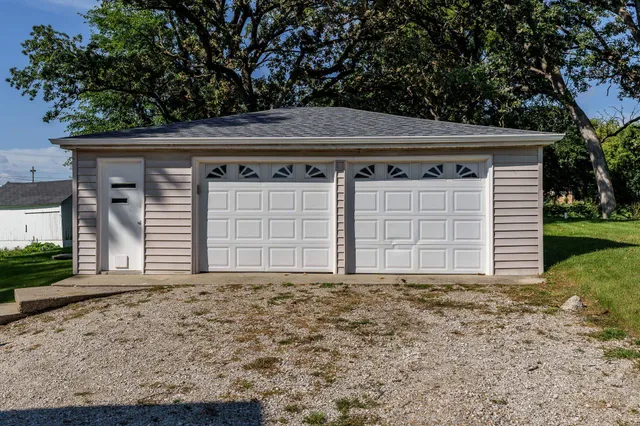 a front view of a house with garage
