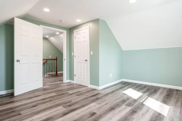 a view of hallway with wooden floor