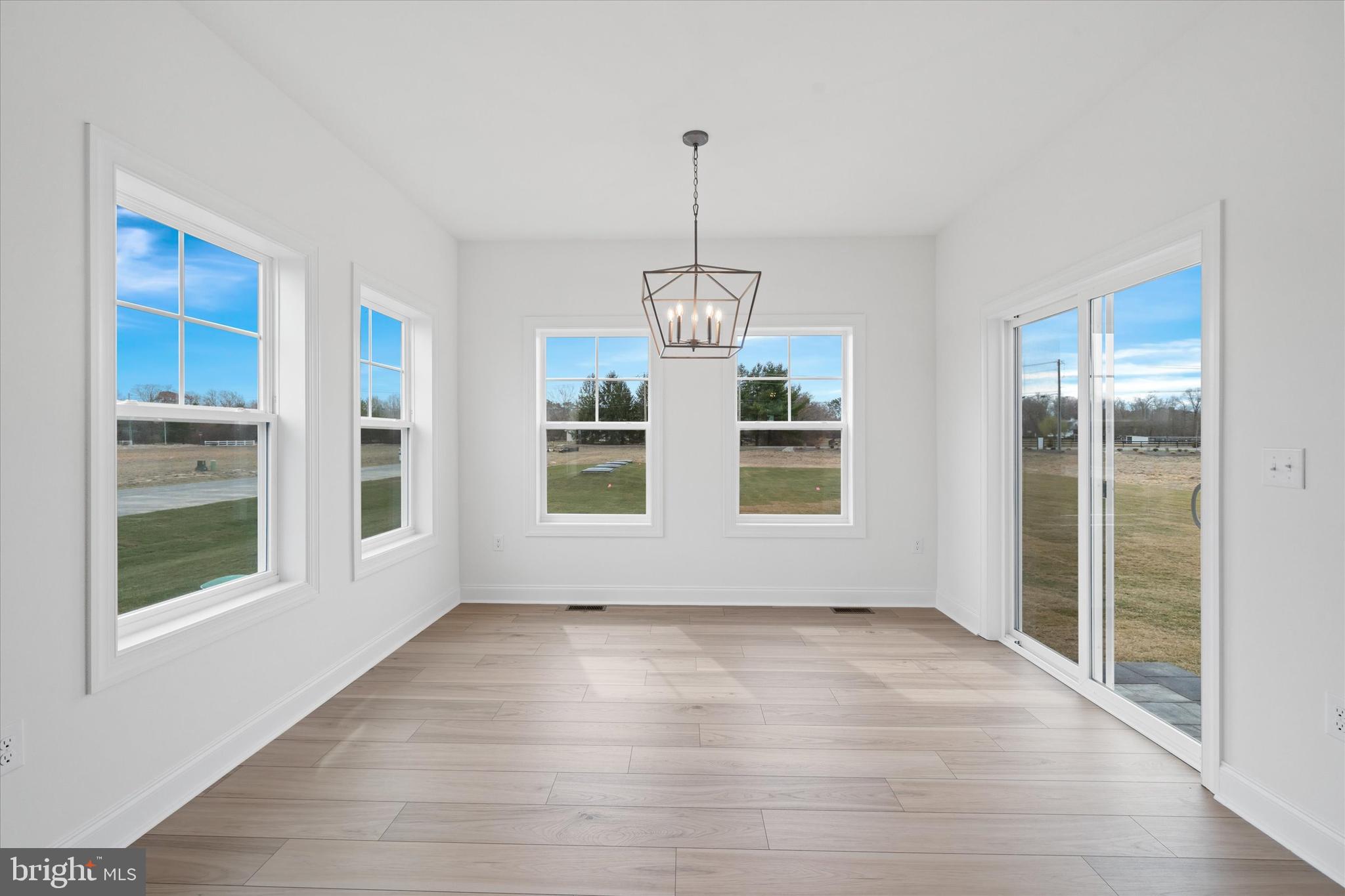 Lot#20 Hummingbird Road Ellendale, DE 19941 - Photo 18 of 41 a view of wooden floor and windows in a room