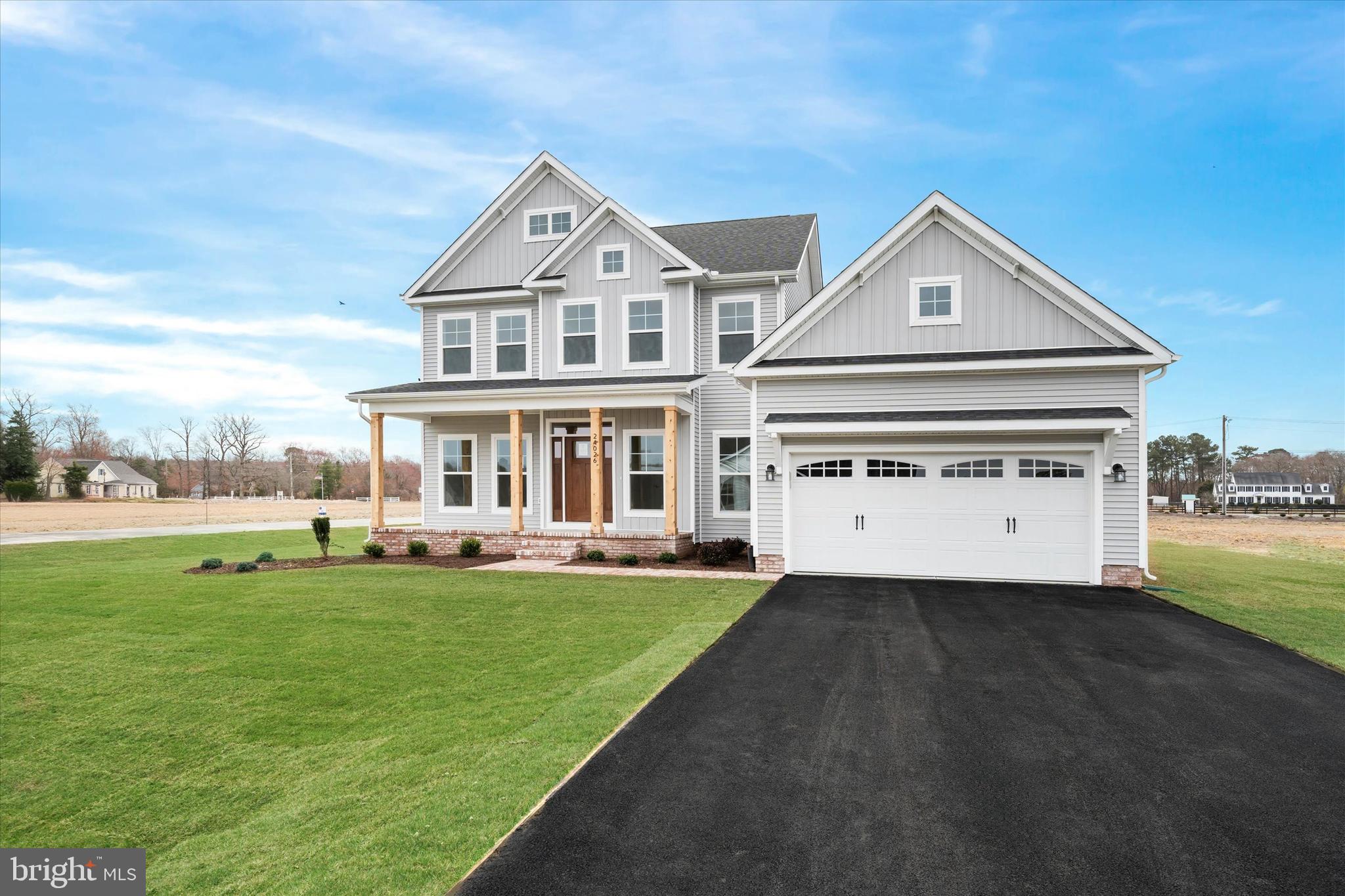 Lot#20 Hummingbird Road Ellendale, DE 19941 - Photo 2 of 41 a view of a white house with a big yard and potted plants