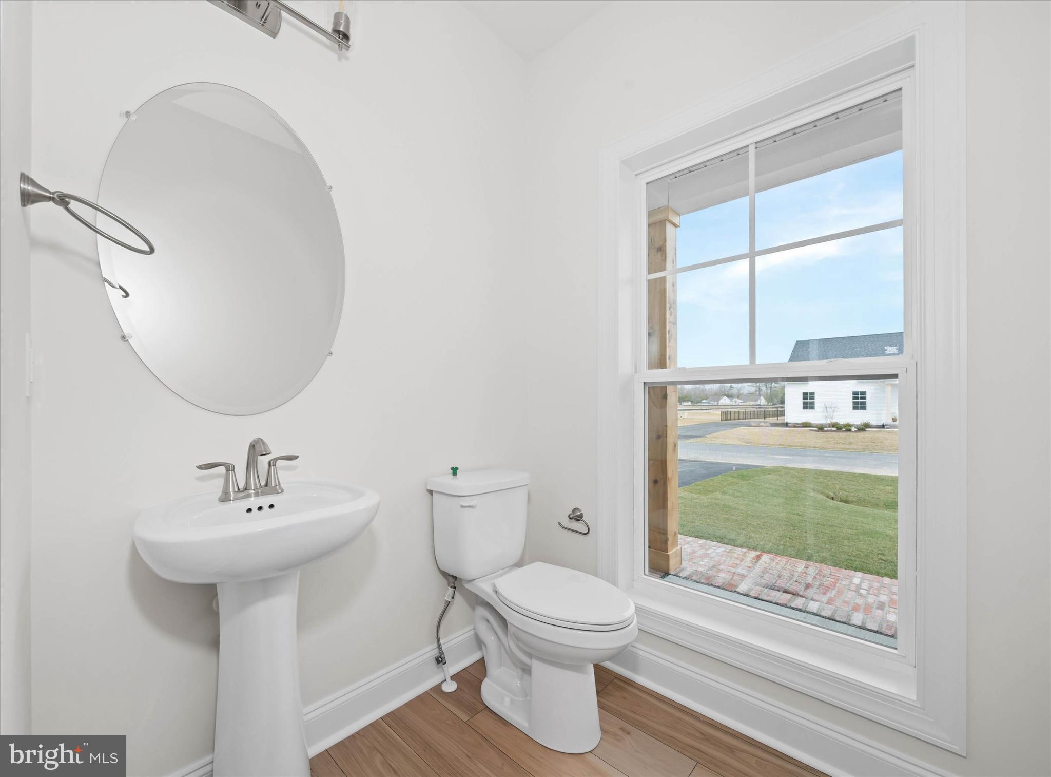 Lot#20 Hummingbird Road Ellendale, DE 19941 - Photo 21 of 41 a bathroom with a sink a toilet and tub