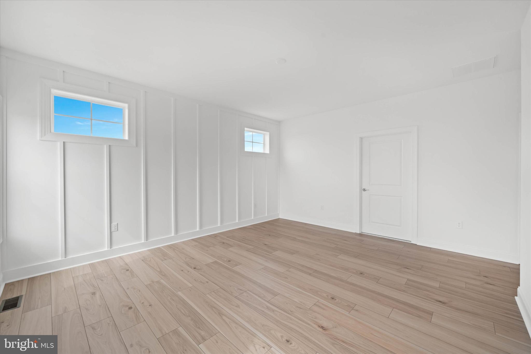 Lot#20 Hummingbird Road Ellendale, DE 19941 - Photo 23 of 41 a view of an empty room and wooden floor