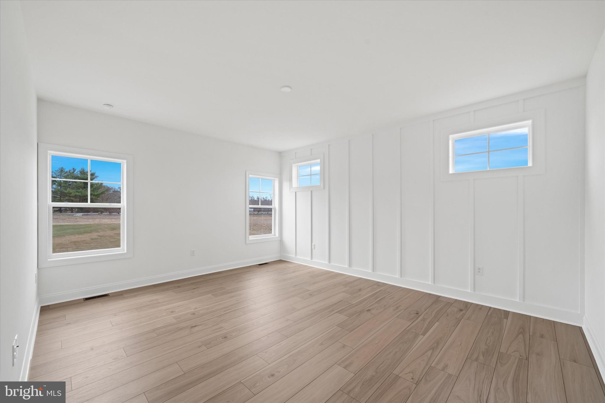 Lot#20 Hummingbird Road Ellendale, DE 19941 - Photo 24 of 41 a view of an empty room with wooden floor and a window