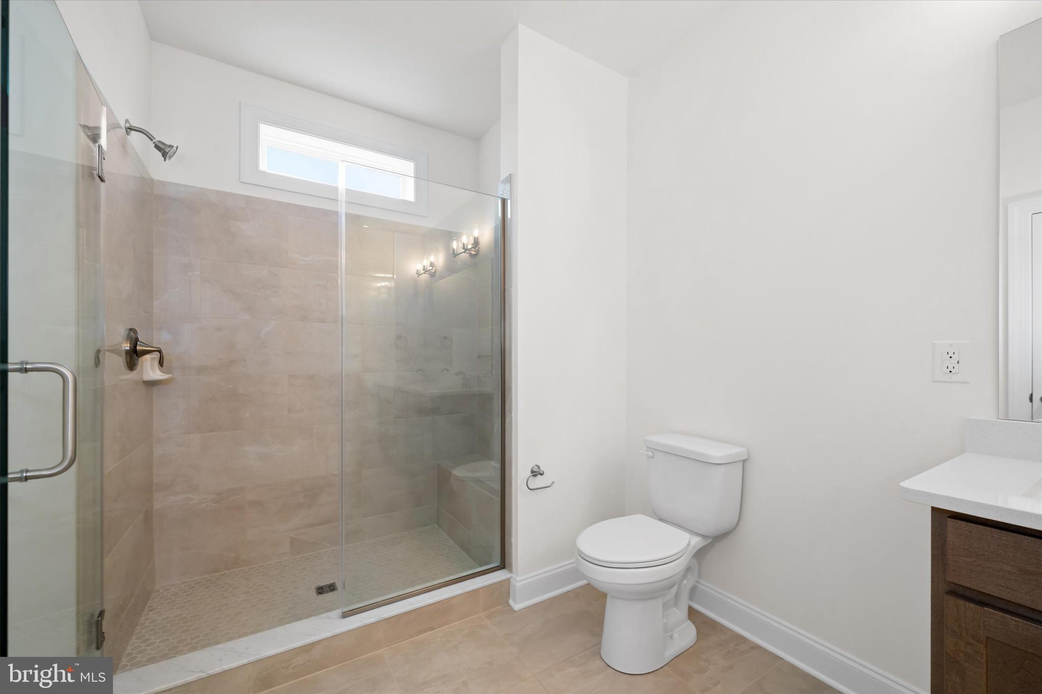 Lot#20 Hummingbird Road Ellendale, DE 19941 - Photo 26 of 41 a bathroom with a toilet and a shower