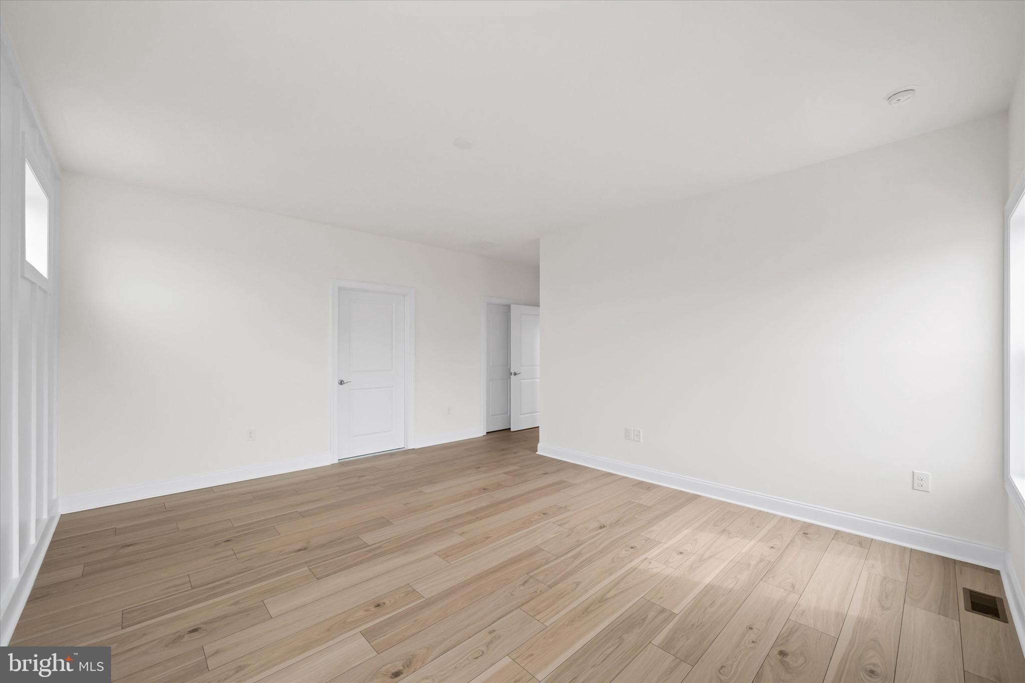 Lot#20 Hummingbird Road Ellendale, DE 19941 - Photo 28 of 41 an empty room with wooden floor