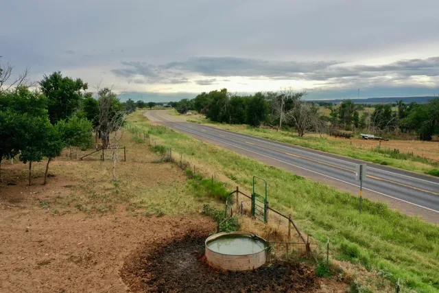 a view of a yard with furniture