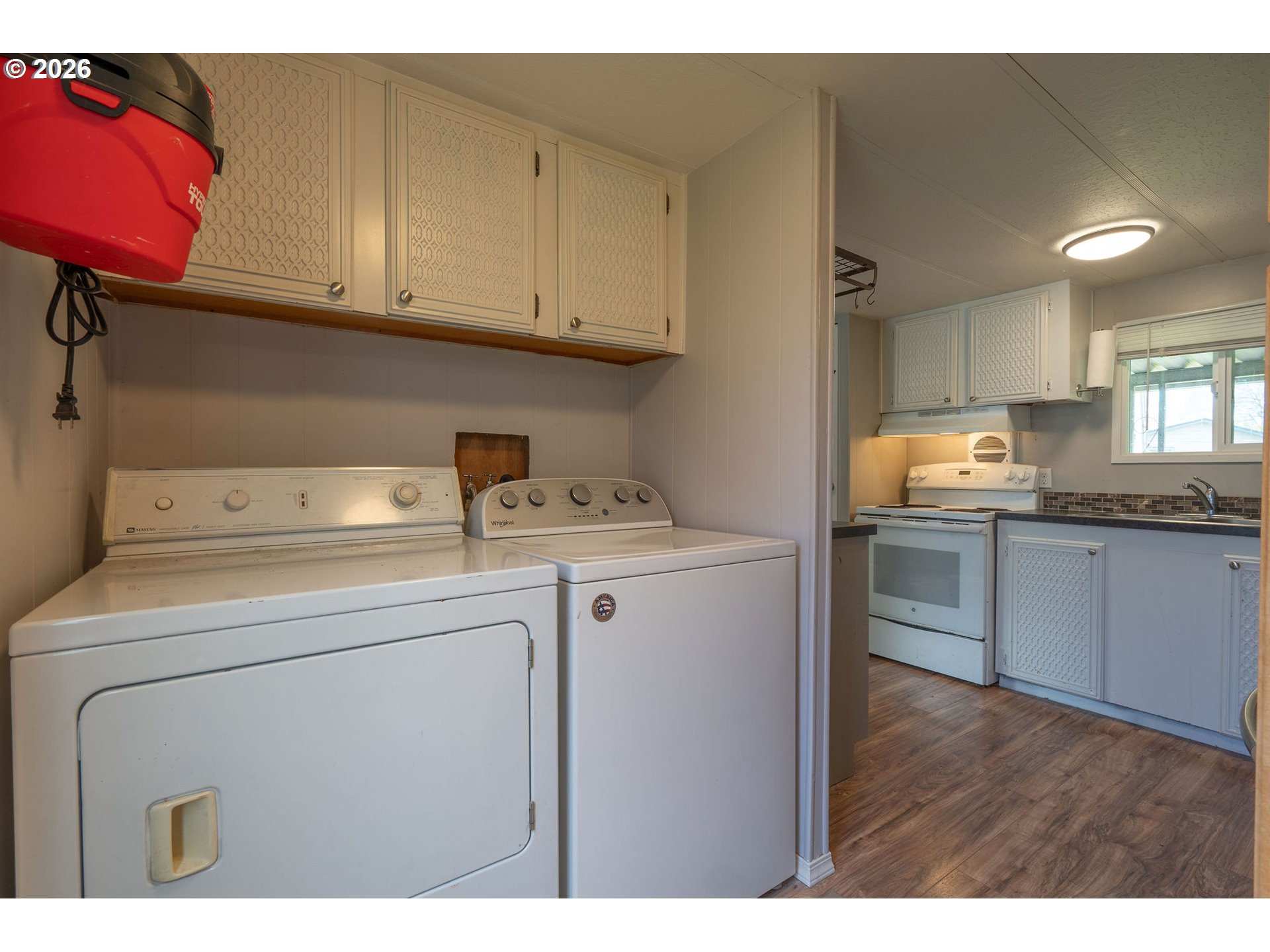 2010 Southwest 3rd Street, Unit 16 Corvallis, OR 97333 - Photo 12 of 16 a kitchen with a sink cabinets and wooden floor