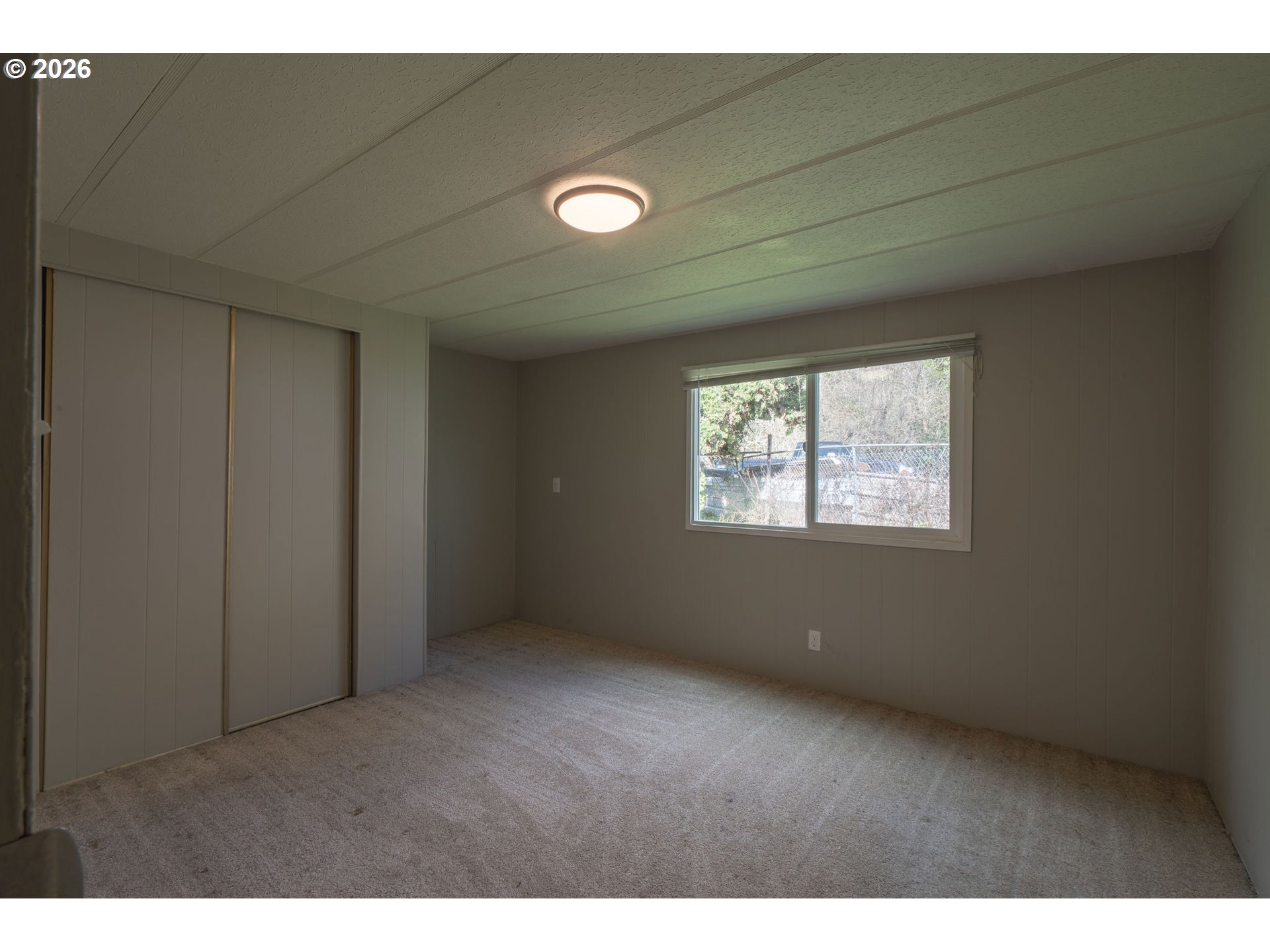 2010 Southwest 3rd Street, Unit 16 Corvallis, OR 97333 - Photo 16 of 16 a view of an empty room with a window