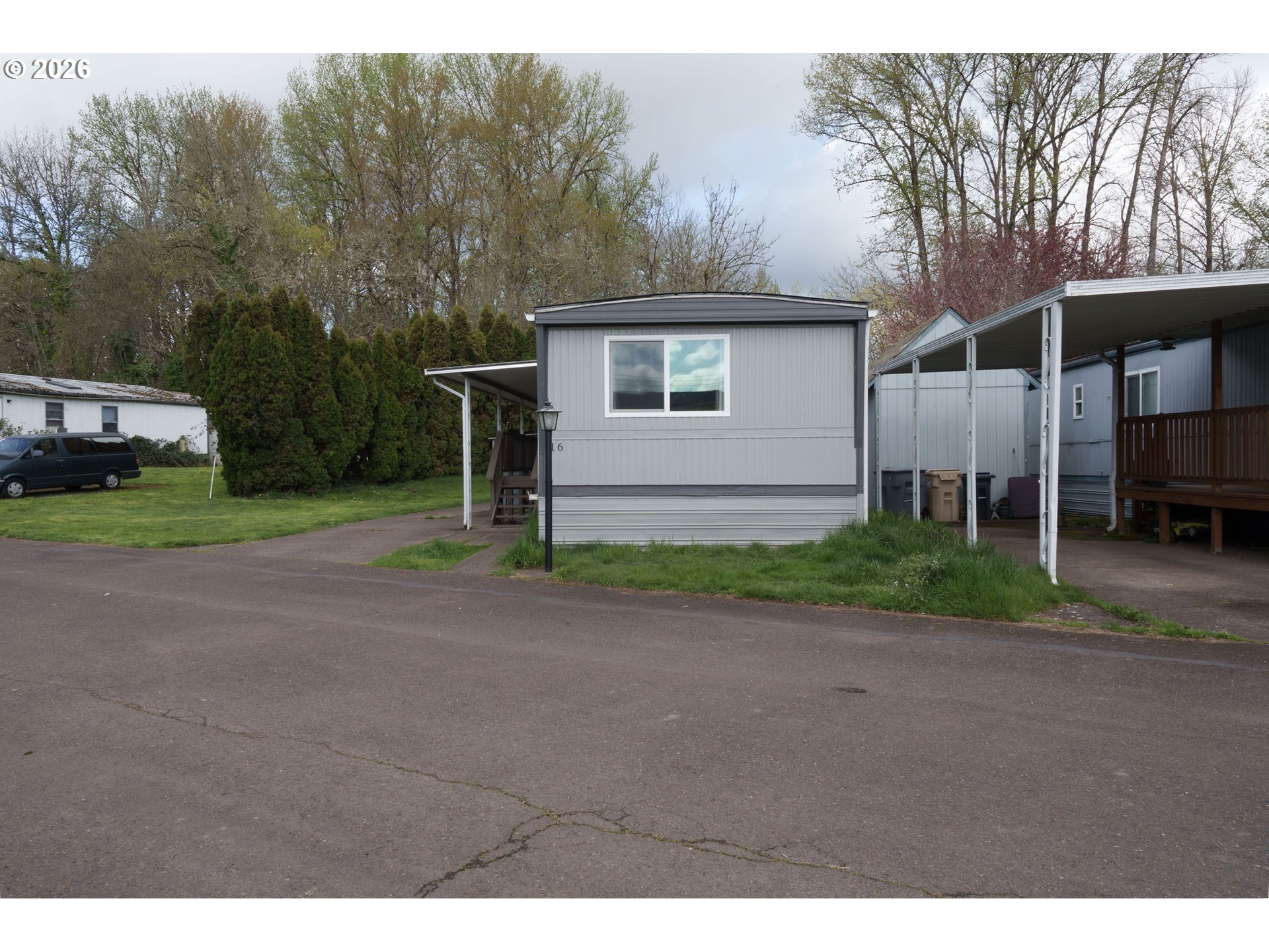 2010 Southwest 3rd Street, Unit 16 Corvallis, OR 97333 - Photo 3 of 16 a view of a house with a yard and garage