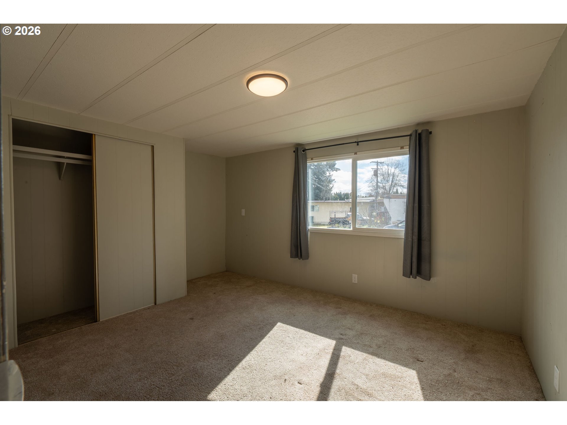 2010 Southwest 3rd Street, Unit 16 Corvallis, OR 97333 - Photo 5 of 16 a view of an empty room with a window