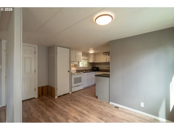 a kitchen with a refrigerator and window
