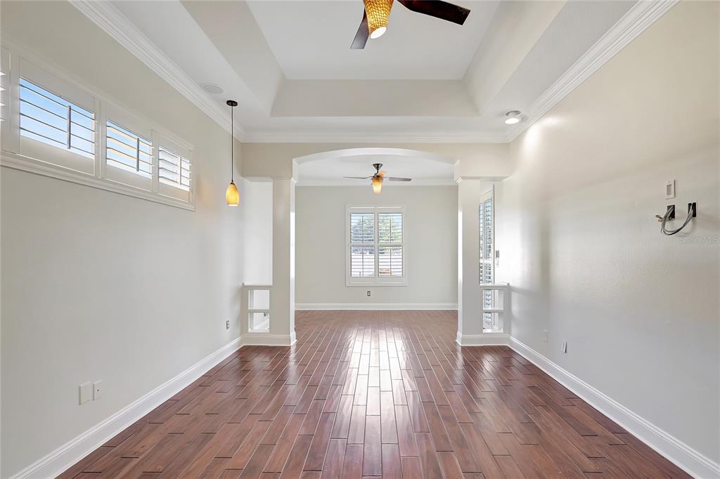 2863 Duncan Tree Circle Valrico, FL 33594 - Photo 42 of 53 wooden floor in an empty room with a window
