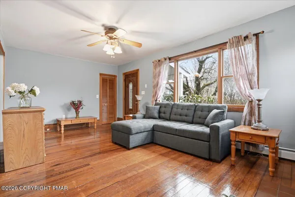 a living room with furniture and a large window