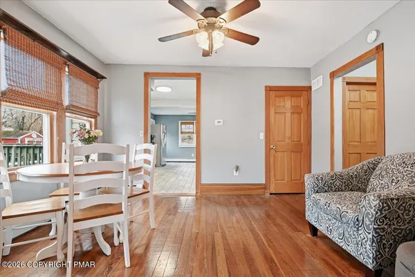 a kitchen with stainless steel appliances granite countertop grey cabinets a stove a sink and dishwasher