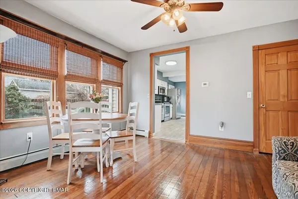 a kitchen with granite countertop a stove top oven microwave and cabinets