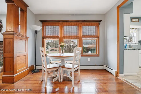 a kitchen with stainless steel appliances a refrigerator and a window