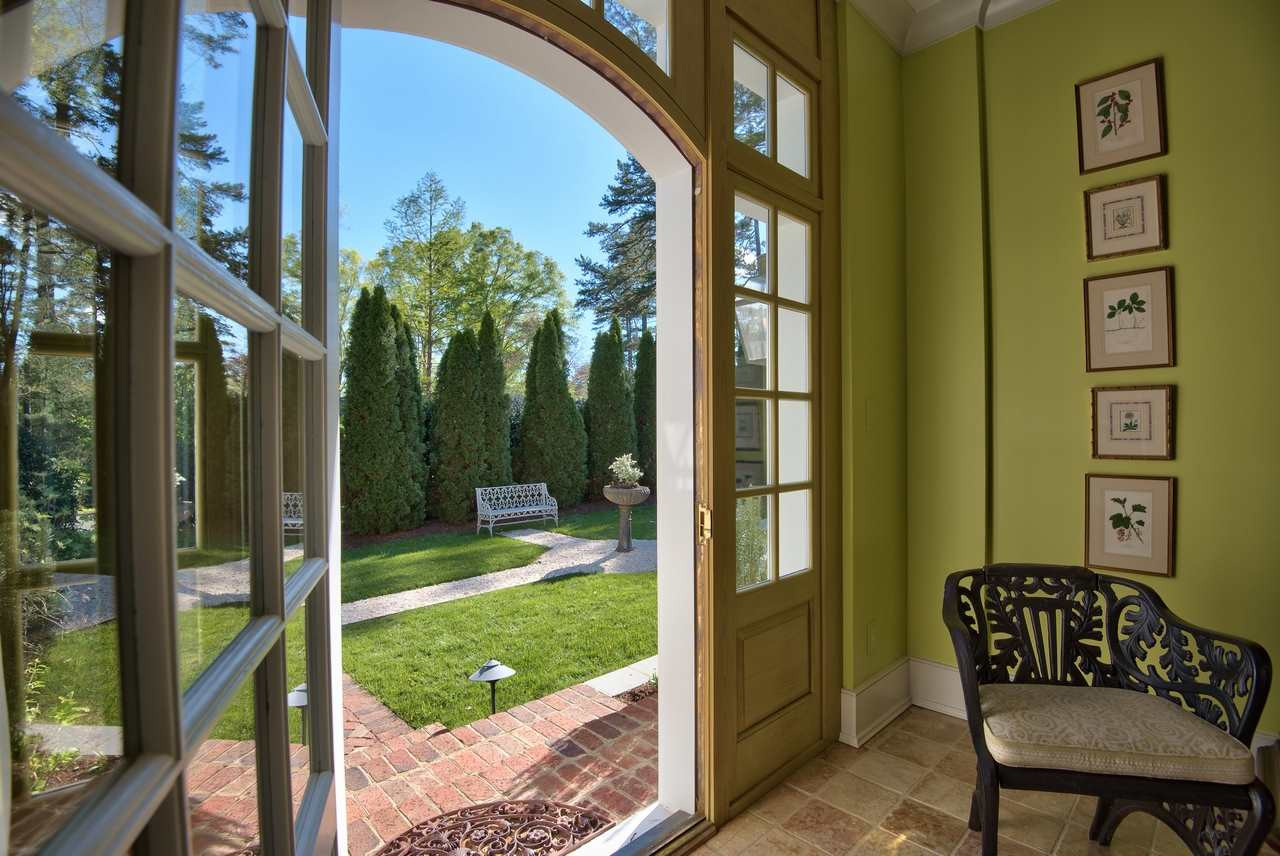3114 Devon Road Durham, NC 27707 - Photo 14 of 25 a view of a porch with a table and chairs