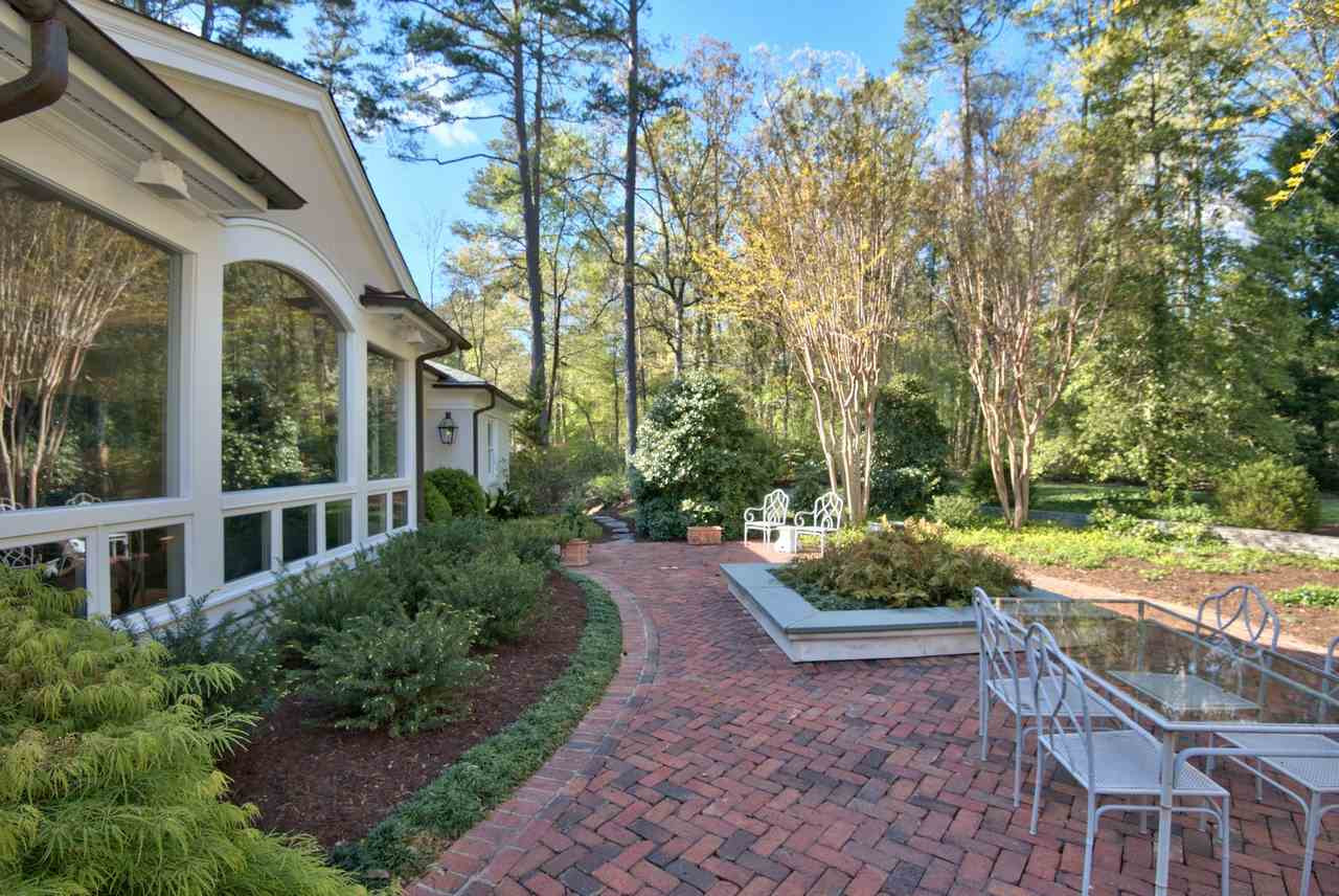 3114 Devon Road Durham, NC 27707 - Photo 20 of 25 a view of a patio with table and chairs and potted plants
