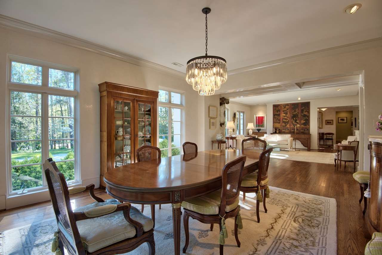 3114 Devon Road Durham, NC 27707 - Photo 5 of 25 a view of a dining room with furniture window and wooden floor
