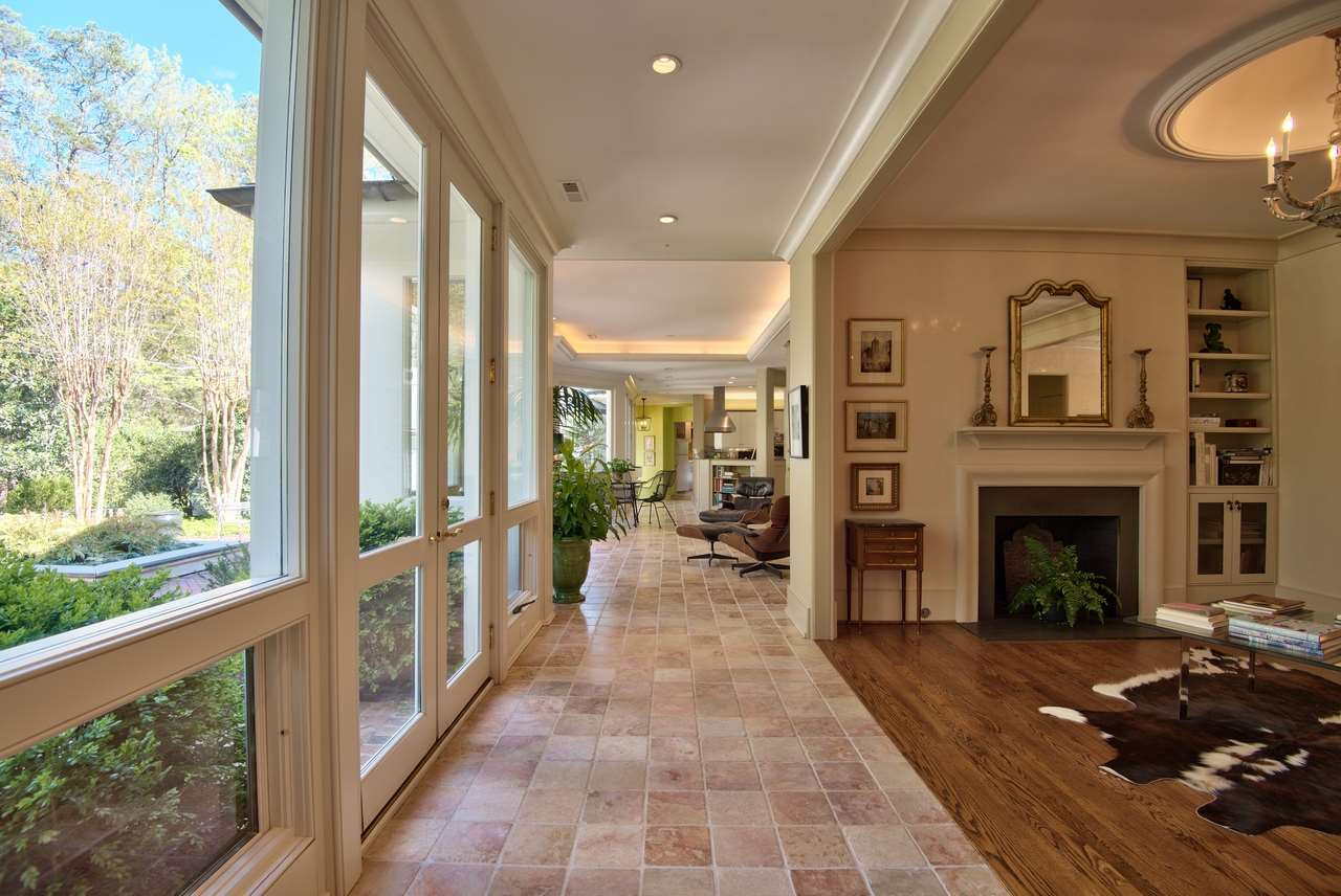 3114 Devon Road Durham, NC 27707 - Photo 7 of 25 a view of a porch with chairs and floor to ceiling window