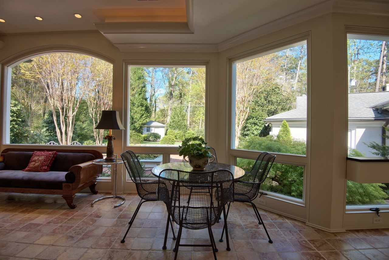 3114 Devon Road Durham, NC 27707 - Photo 9 of 25 a dining room with furniture and a floor to ceiling window