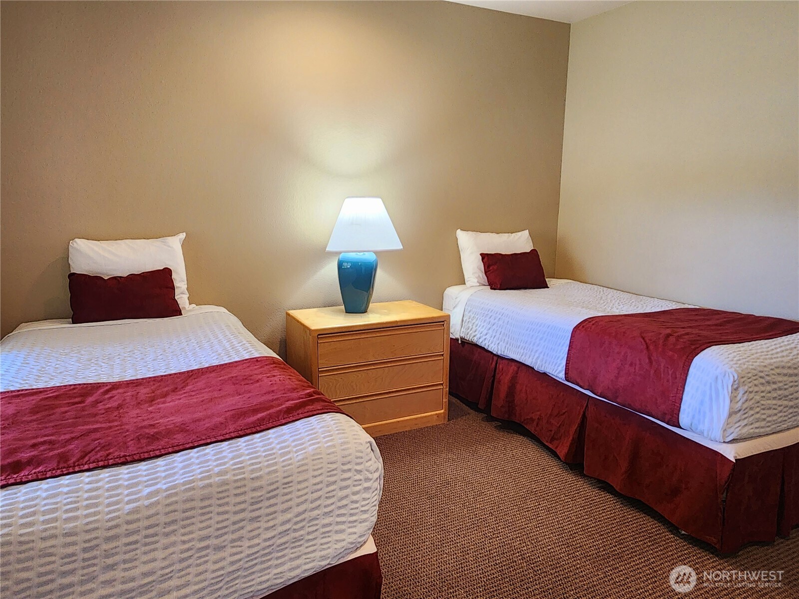 1 Lakeside 714-o Manson, WA 98831 - Photo 12 of 35 a bedroom with a bed and lamp