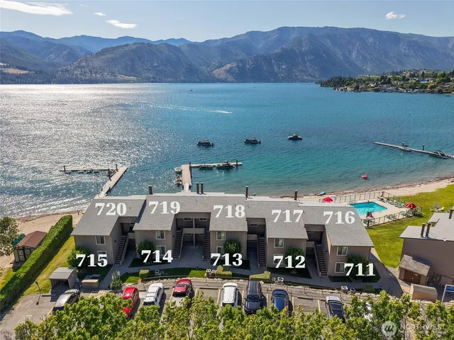 a view of a two chairs in the back yard of a house