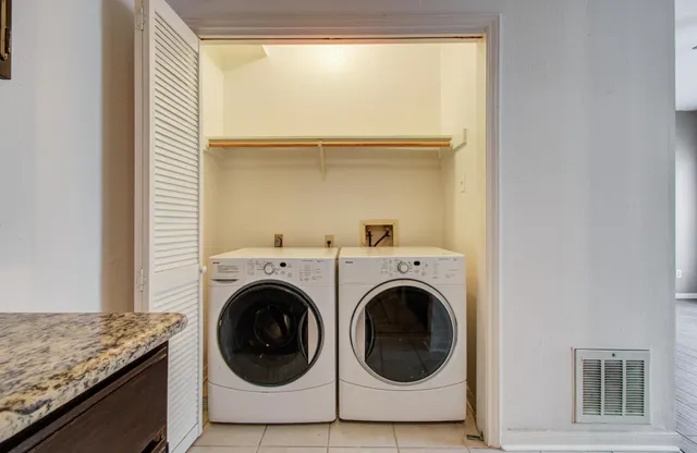 a utility room with dryer and washer