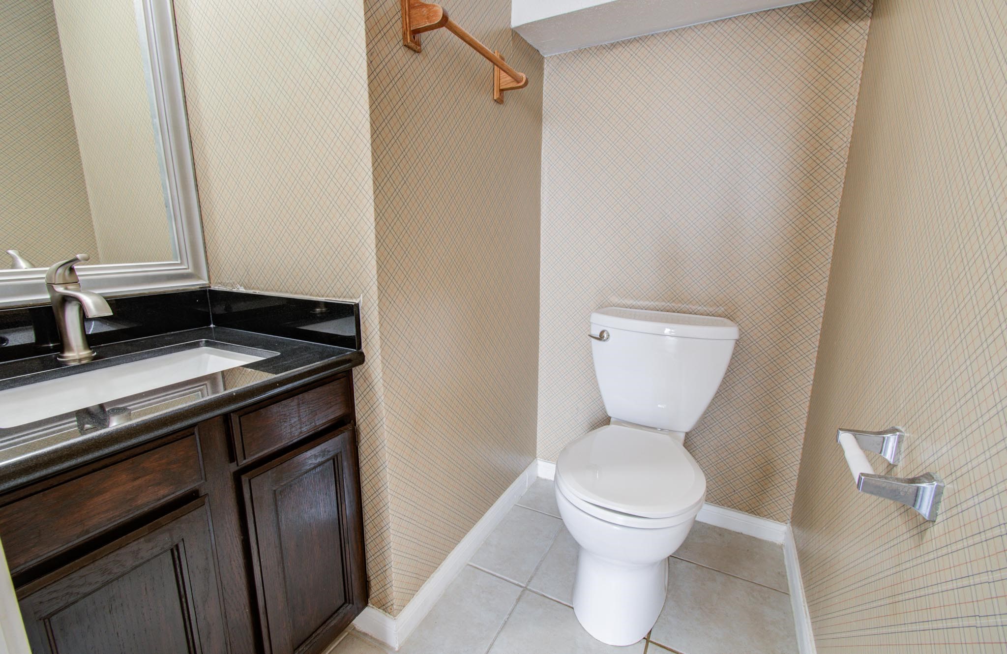 8299 Cambridge Street, Unit 1706 Houston, TX 77054 - Photo 14 of 26 a bathroom with a toilet and a sink