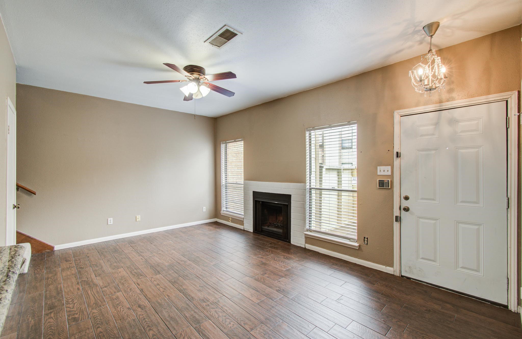 8299 Cambridge Street, Unit 1706 Houston, TX 77054 - Photo 4 of 26 wooden floor in an empty room with a window