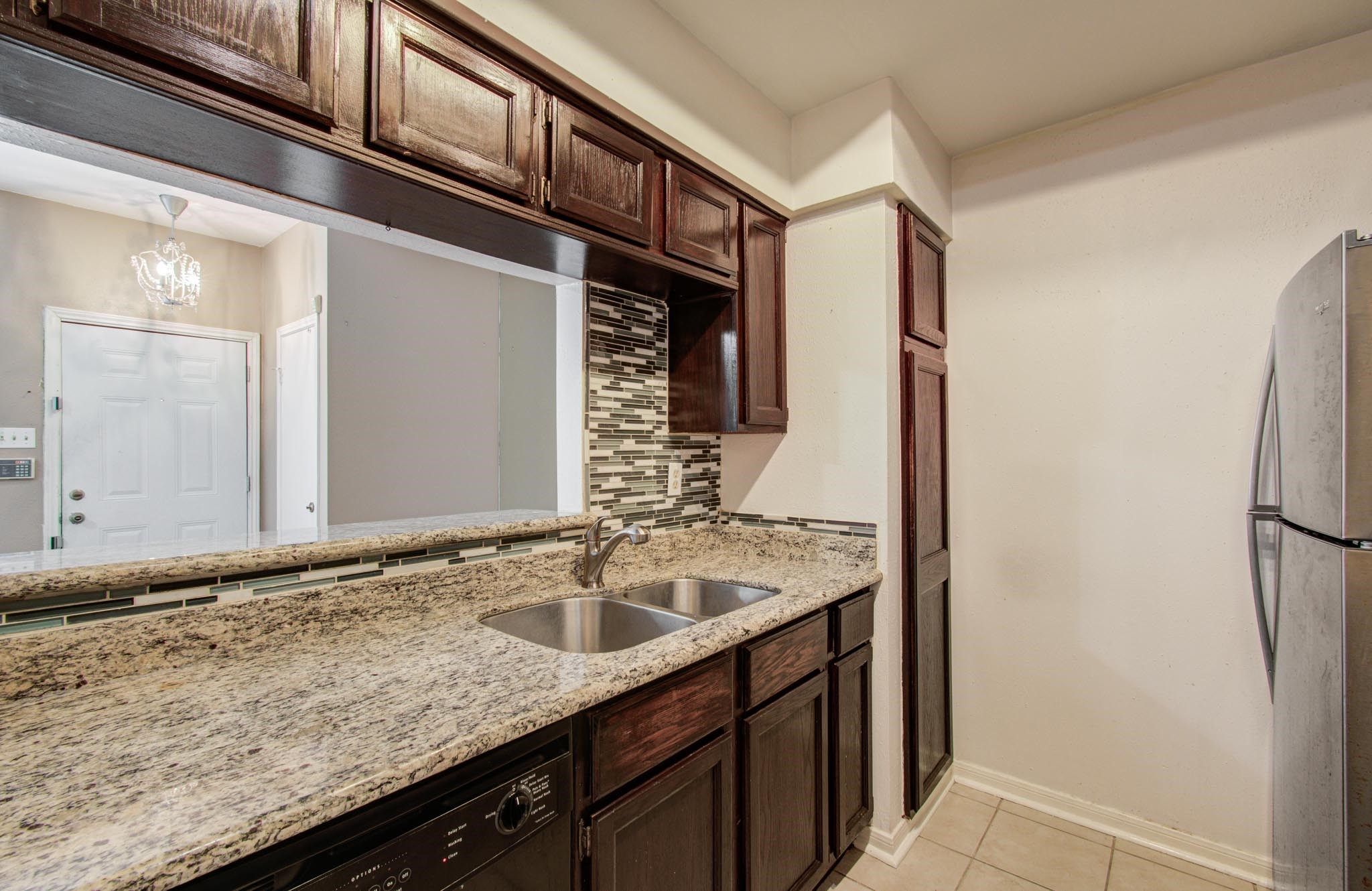 8299 Cambridge Street, Unit 1706 Houston, TX 77054 - Photo 10 of 26 a bathroom with a granite countertop sink and a mirror