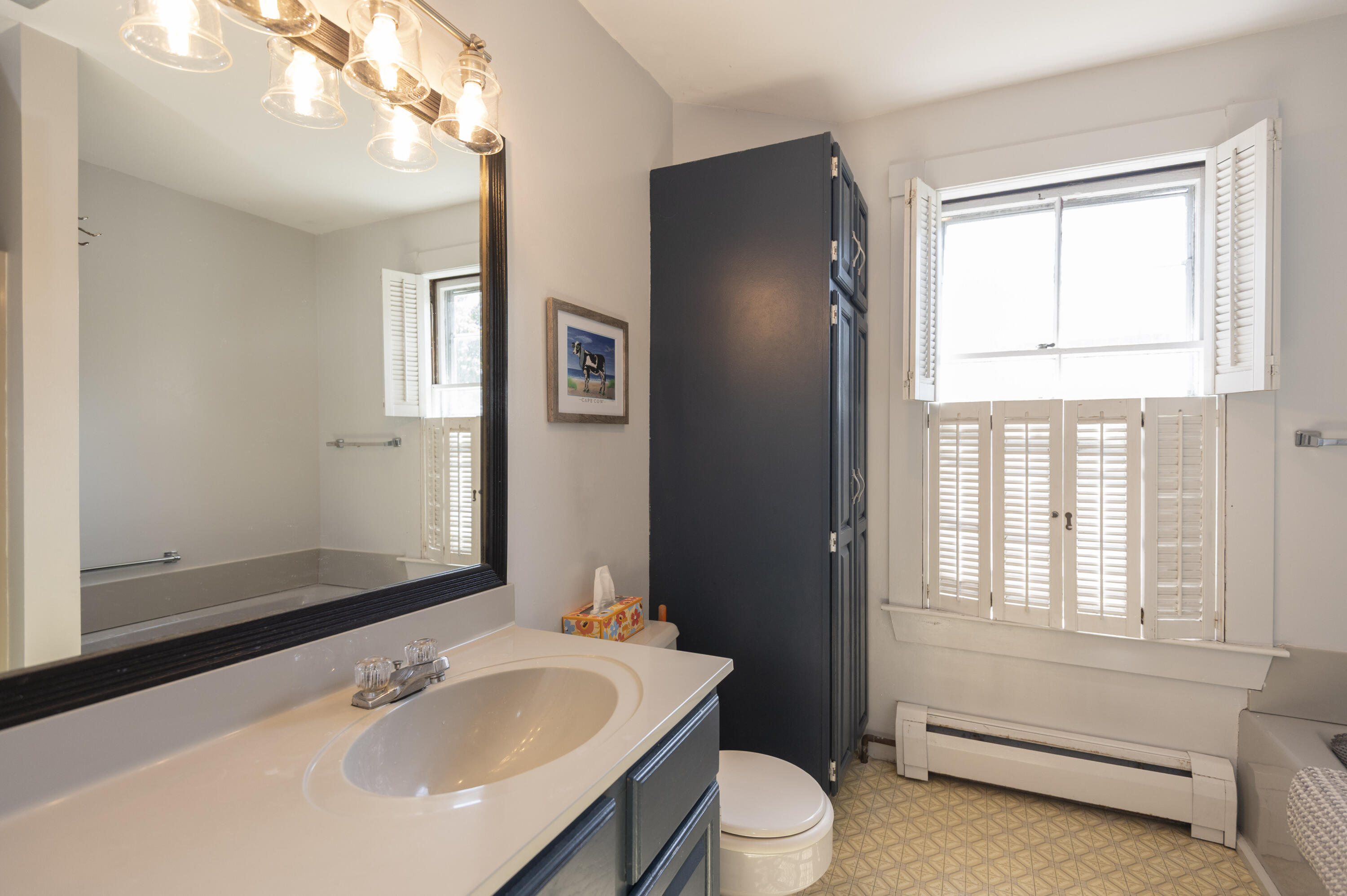 15 Bowditch Road Falmouth, MA 02543 - Photo 11 of 16 a bathroom with a sink toilet and shower