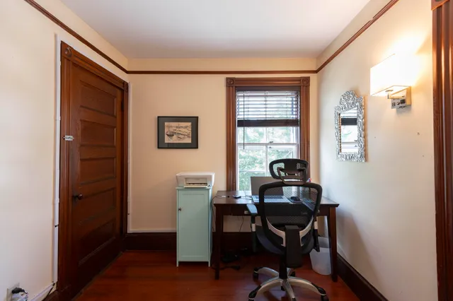a workspace with furniture and wooden floor