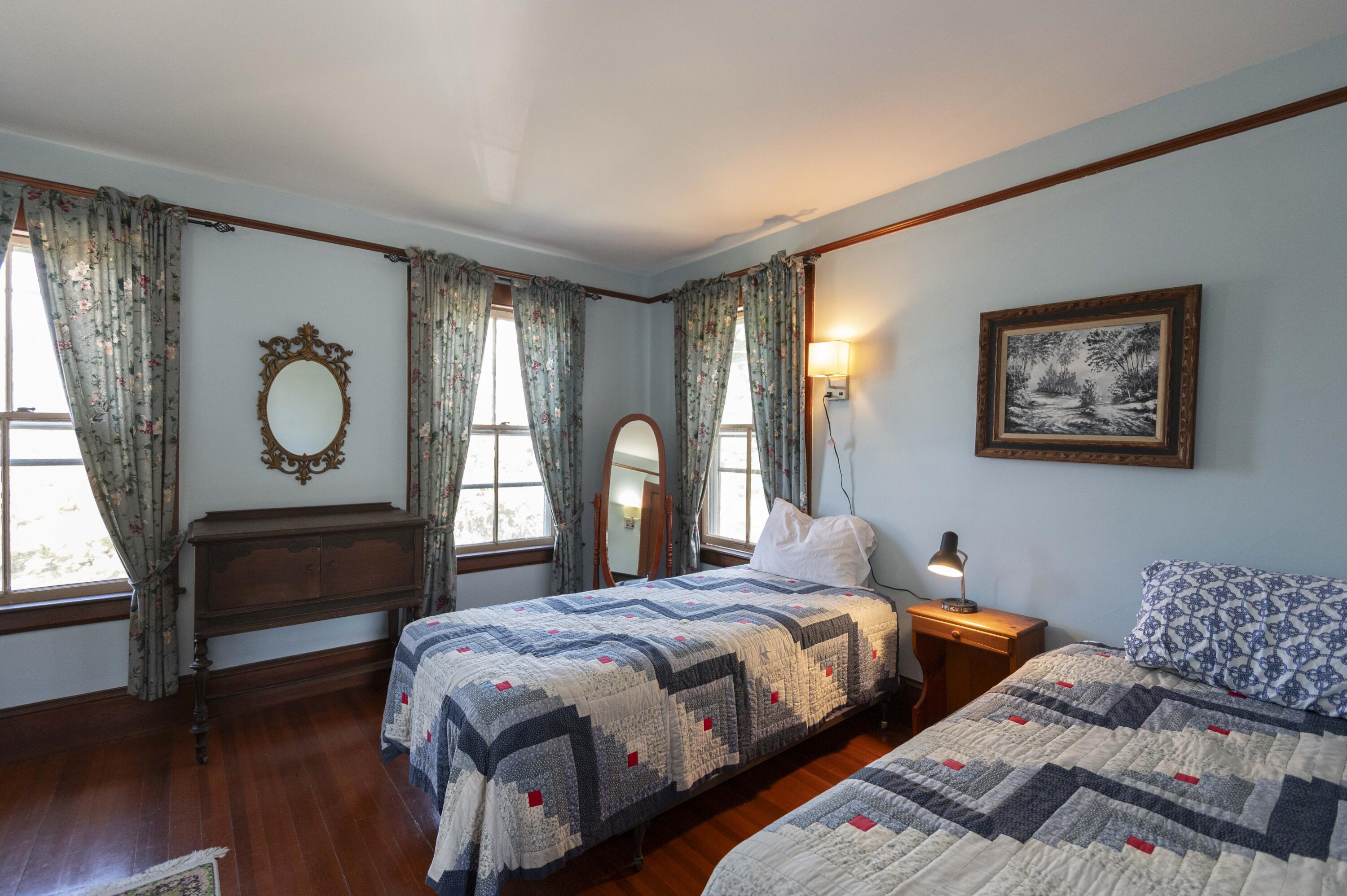 15 Bowditch Road Falmouth, MA 02543 - Photo 10 of 16 a bedroom with bed mirror and window