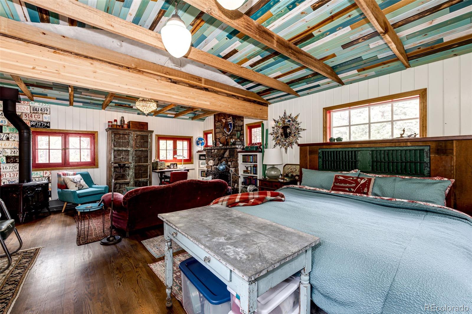 12346 Bear Haven Road Conifer, CO 80433 - Photo 35 of 47 a view of a livingroom with furniture and a fireplace