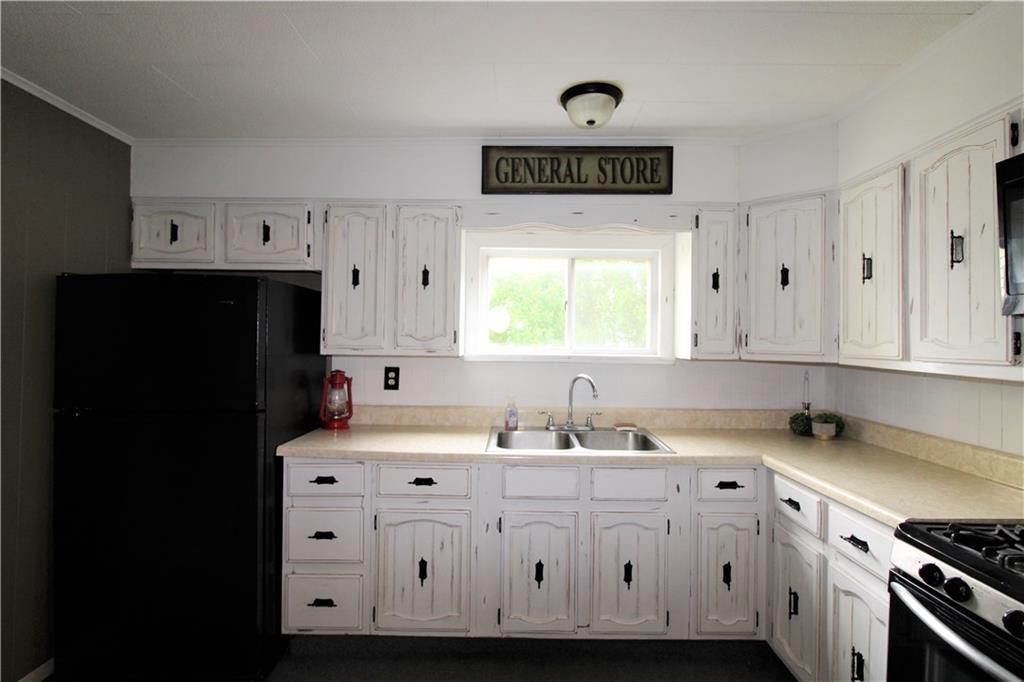 1029 Main Street East Rural Valley, PA 16249 - Photo 14 of 24 The kitchen has been painted and comes with refrigerator, microwave and gas range